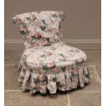 A Victorian low seat upholstered chair, the bow front sprung seat upon gilt wood vase shaped front