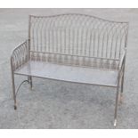 A Regency style painted metal strap and wirework garden/patio bench, 20th century, the serpentine