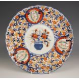 A Japanese porcelain charger Meiji period (1868-1912) the lobed circular charger decorated in the