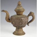 A Sino-Tibetan brass ewer, 19th/20th century, the globular body with character mark roundels against
