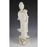 A large Chinese porcelain blanc de chine figure of Guanyin, 19th century, modelled standing in robes