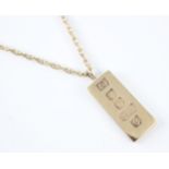 A 9ct yellow gold ingot pendant, stamped 'IJ' Sheffield 1977, upon a later associated yellow metal