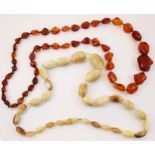A graduated amber necklace, comprising forty-six free form shaped beads, ranging from 12mm – 30mm in