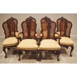 A set of eight Italian carved walnut dining chairs, mid 20th century, each with a shell and 'C'