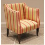 An Edwardian mahogany and upholstered tub chair, re-covered in vibrant striped fabric, upon tapering