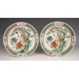A pair of Chinese porcelain famille verte porcelain plates, 19th century in the Kangxi style, each