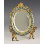 A French lacquered brass and champleve enamel mirror, late 19th or early 20th century, the enamel
