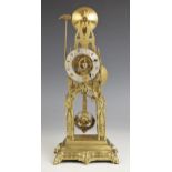 A brass Gothic influence skeleton clock, 20th century, with an 8cm silvered chapter ring, single