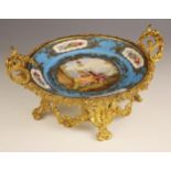 A Sevres Chateau des Tuileries ormolu mounted tazza, 19th century, the well painted with a