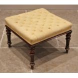 A Victorian walnut square section footstool, the upholstered button down seat, upon knopped and