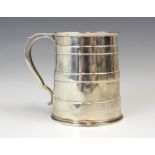 A Victorian silver mug, Martin Hall and Co, Sheffield 1867, the scroll handle above a body with