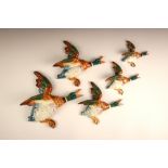 A set of five graduated Beswick wall mallard ducks, model numbers: 196 - 8, 506 - 2, 596 - 0,