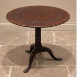 A George II red walnut tripod table, possibly Irish, the circular top with an incised scroll frieze,