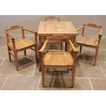 A pine folding table with four pine elbow chairs, probably continental, late 20th century, the