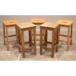 A trio of beech wood bar stools, by Remploy, mid to late 20th century, each with a shaped seat