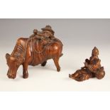 A Chinese carved wood model of a buffalo, late 19th century, modelled with a boy on his back, 12cm