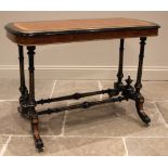 A Victorian ebonised satinwood and amboyna occasional table, the rounded rectangular top with a