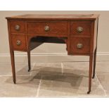 A late 19th/early 20th century satinwood kneehole desk, of slight angular bowfront form, the