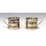 A pair of early 20th century silver plated chamber sticks, the cylindrical shaped body with