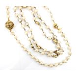 A Chanel faux pearl necklace, the non uniform faux pearls with emerald cut paste double sided set