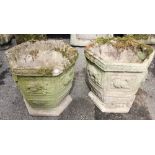 Two reconstituted stone hexagonal planters, of tapering cup form, moulded in relief with
