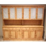 A large Victorian style pine dresser/housekeepers cupboard, late 20th century, the moulded cornice