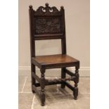 A 17th century oak back stool, probably Lancashire, the three spherical finials over a scrolled