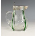 An Edwardian silver mounted cordial jug, early 20th century, of baluster form, the body with applied