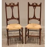 A pair of Arts & Crafts oak and rush seated bedroom/side chairs, early 20th century, each chair with