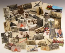 WORLD WAR II INTEREST: A collection of over eighty postcards, photocards and photographs depicting