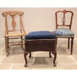 A George II mahogany box stool, with a hinged and upholstered serpentine seat, brass side swing