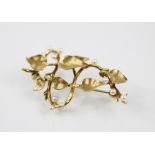 A late 20th century 9ct yellow gold and seed pearl spray brooch, the plain polished stylised stem