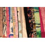 A collection of silk scarves, to include, a Liberty iris pattern scarf, a Burberrys check pattern