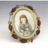 An oval brass and enamel oval picture frame retailed by Howell James & Co, late 19th or early 20th