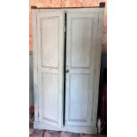 A Victorian painted pine kitchen cupboard, the twin panelled doors opening to four fixed shelves,