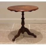 An Edwardian walnut tripod lamp/occasional table, the segmented veneer top centred with boxwood