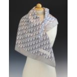 A Christian Dior silk scarf, in grey monogram within a grey border, with rolled hem, 77cm x 77cm,
