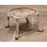A 19th century painted cast iron urn stand, the circular rim with six lugs upon four foliate cast