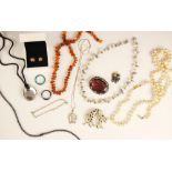 A collection of costume jewellery to include; amber coloured beads with twist barrel clasp,