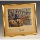 QUEEN ELIZABETH II INTEREST: A printed photograph of Princess Elizabeth mounted side saddle on a