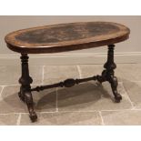 A Victorian figured walnut oval centre/occasional table, the moulded top inset with a leather