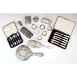 A selection of silver items, including four silver napkin rings, a George V silver pepperette, Atkin