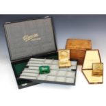 A group of vacant jewellery boxes, including a Champion watch travel case, the case with lift out