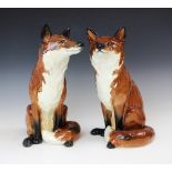 Two Beswick Fireside series models of Foxes, model no. 2348, each modelled seated, printed maker's
