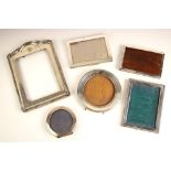 A selection of six silver mounted photograph frames, including an Edwardian silver mounted