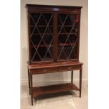 A mahogany and satinwood crossbanded display cabinet on stand, 19th century, the moulded dentil