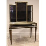 A French brass mounted ebonised bijouterie vitrine, circa 1870, the angular rear structure with a