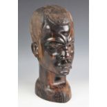 Circle of Benoit Konongo (1919-2008), a large polished coromandel carving of a young mans head, 38.