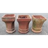 Three terracotta chimney planters, octagonal rims to canted sides and a square base, 43cm high,