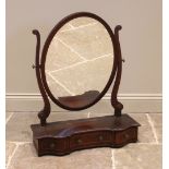 An Edwardian mahogany dressing table mirror, the oval mirror upon curved supports and a shaped